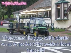 The council buggy with plastic wrap to protect the worker from the cold