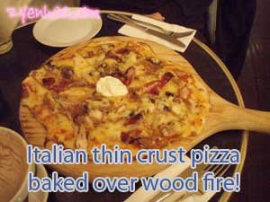Italizan thin crust pizza baked over wood fire!